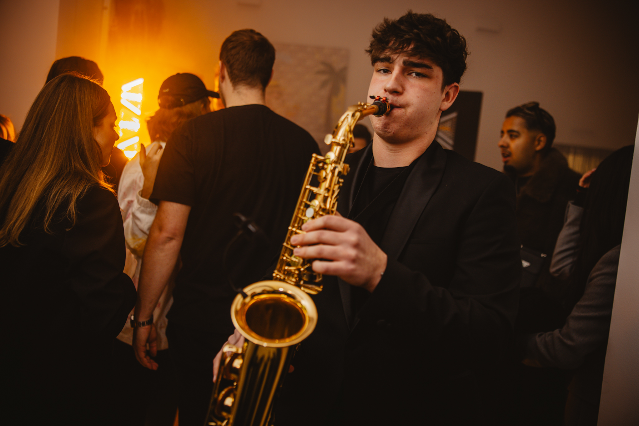 Playing saxophone in the middle of a full dance floor
