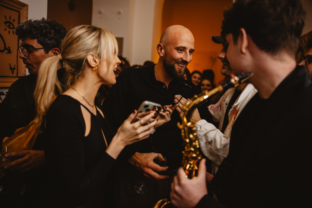 Playing among the guests as the room fills