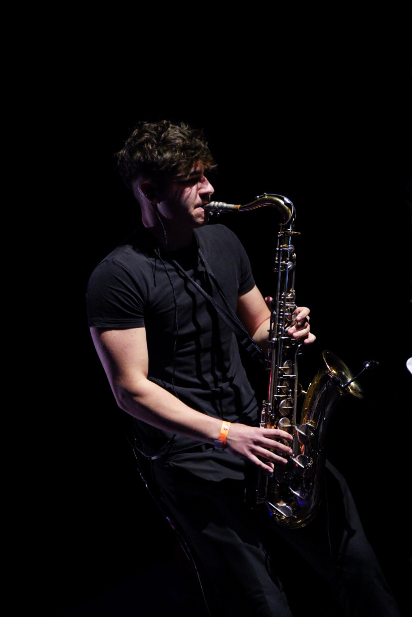 Black and white portrait, mid-phrase on the saxophone