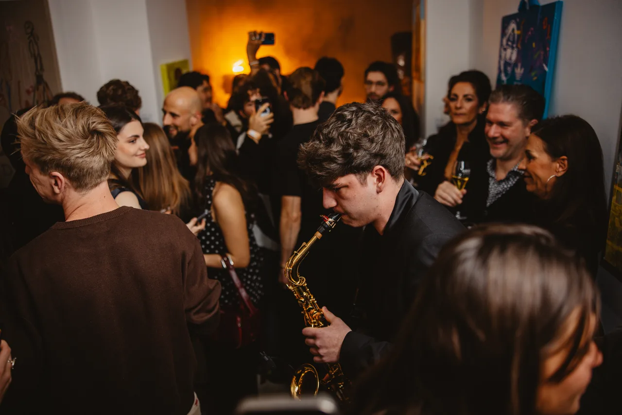 Playing between the guests as a warm-lit room fills up