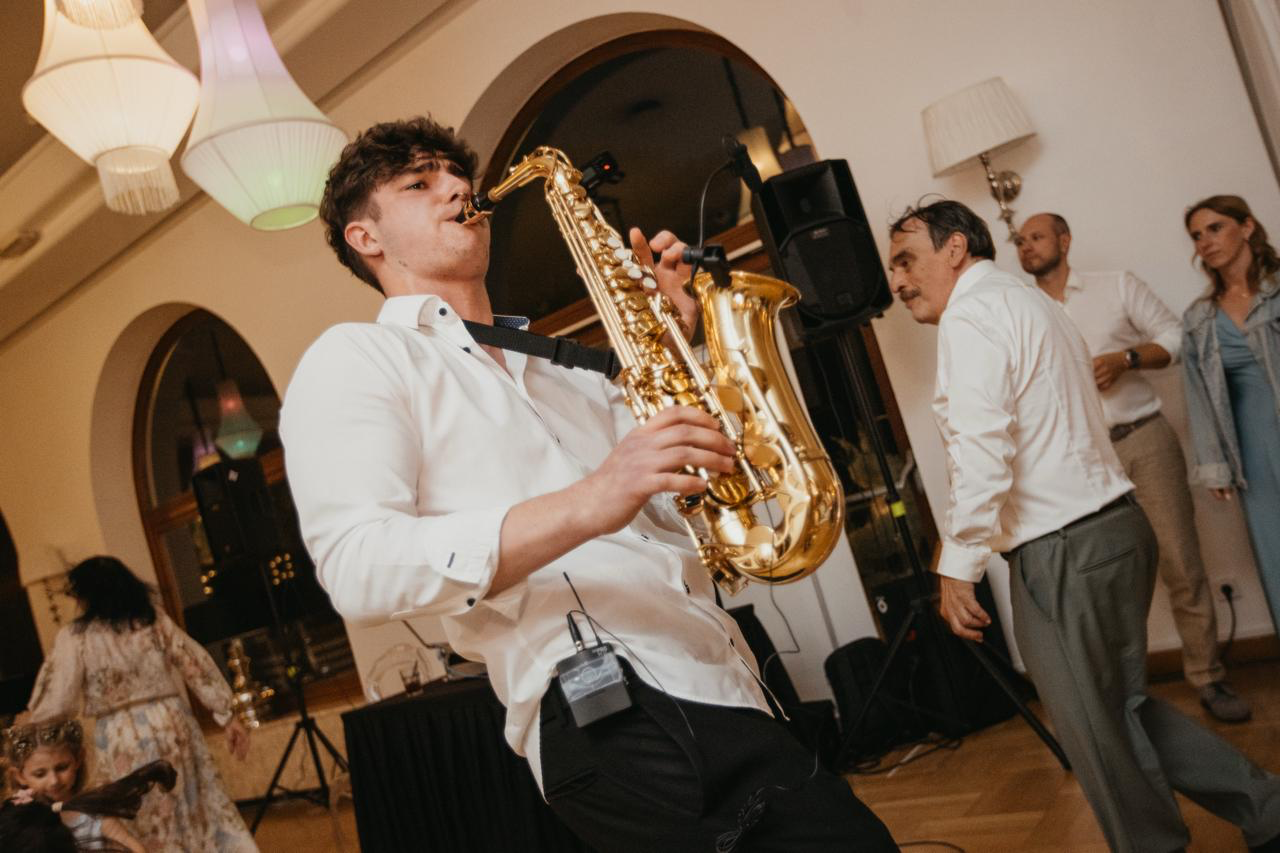 Playing for the newlyweds as the wedding party dances