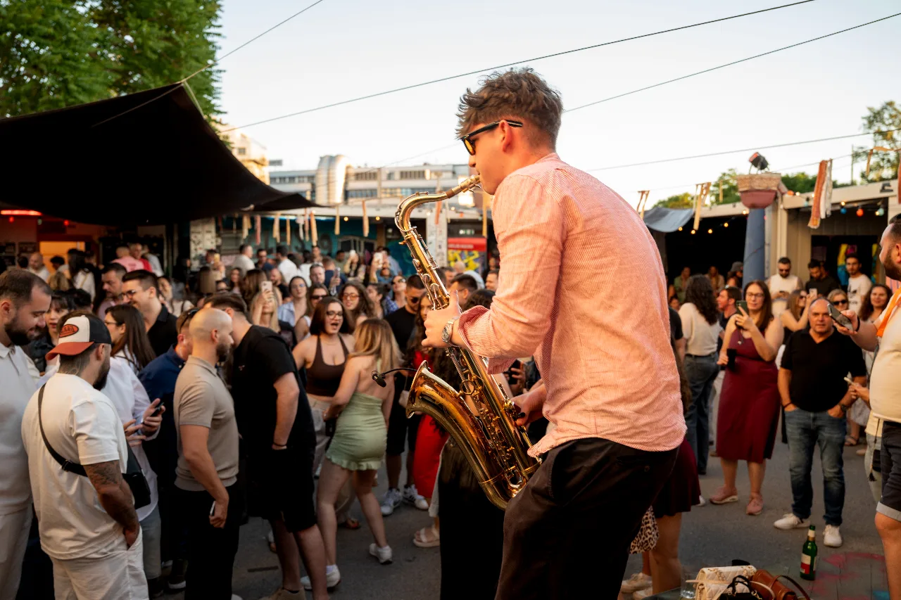Golden hour over a packed open-air floor