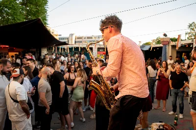 Golden hour over a packed open-air floor